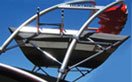 Boat with a Striped Clamp on Tower Bimini Top from Carver