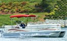 Pontoon Bimini on the Water with a Carver Top
