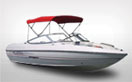 A Super Sport Boat with a Red Carver Bimini Top