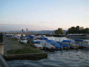 photo of a marina with many boats with covers