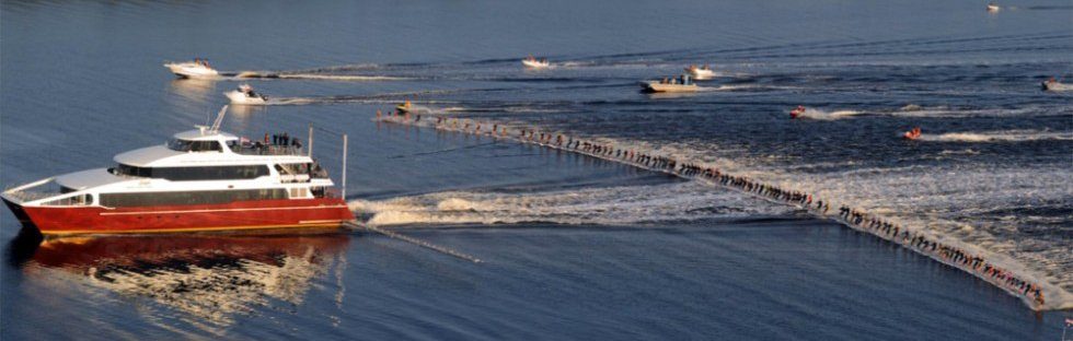 photo of a large boat pulling 145 water skiiers to set a world record
