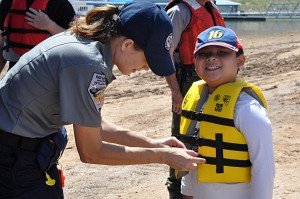 child being fitted for a life jacket