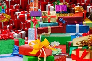 gifts wrapped in multi-colored paper and bows