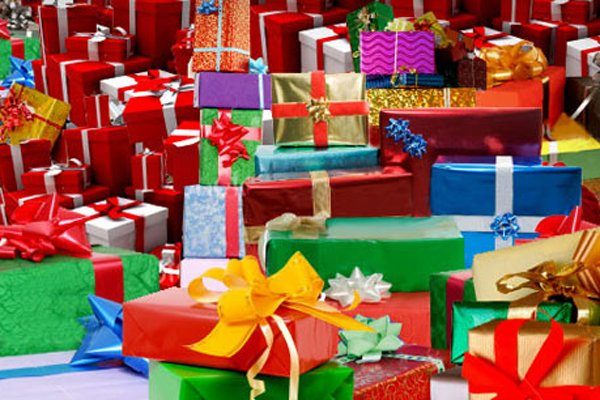 gifts wrapped in multi-colored paper and bows