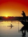 man fishing at sunset
